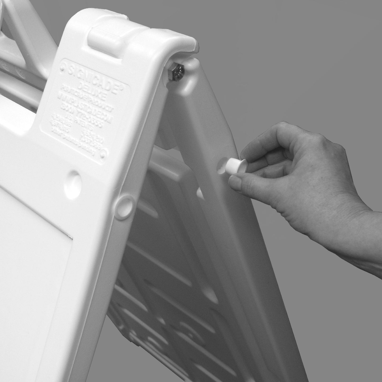 Boguna 24×36 White Plastic A-Frame Sign Stand — sand-fill hole being unplugged for adding weight
