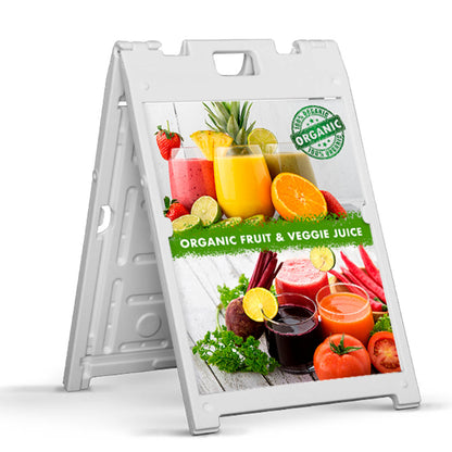 A-frame sidewalk sign promoting organic fruit and veggie juice with colorful drink imagery