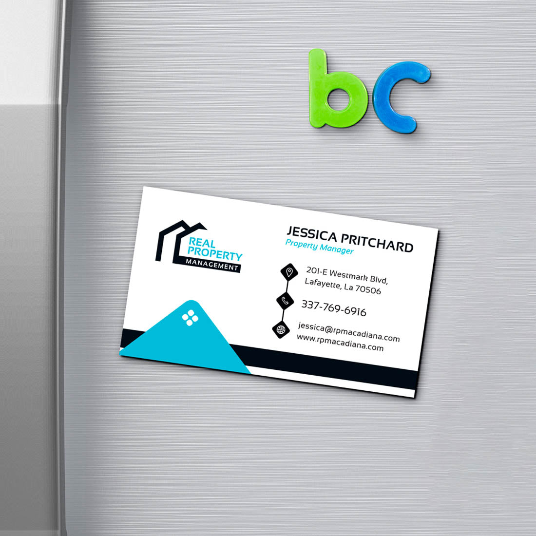 Real Property Management business card displayed as fridge magnet with clean modern design