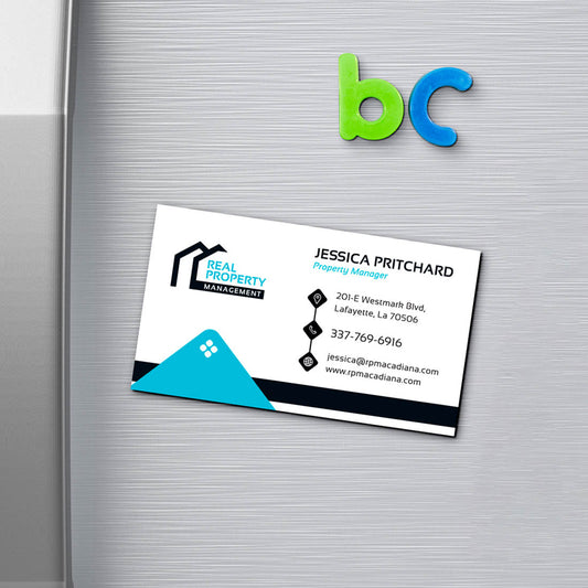 Real Property Management business card displayed as fridge magnet with clean modern design