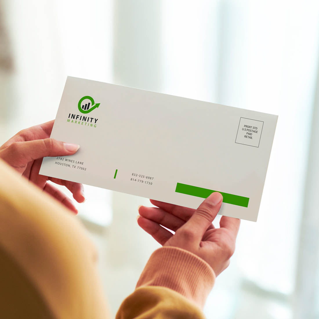 Holding Infinity Marketing branded envelope