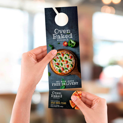 Pizzeria door hanger promoting free delivery with image of fresh baked pizza