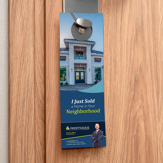 Real estate door hanger announcing a recently sold home with agent branding on door handle